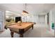 Spacious basement rec room with a pool table, living area, and convenient access to the rest of the house at 1111 Waterford Green Pt, Marietta, GA 30068