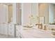 Close-up of bathroom vanity with marble countertop, decorative fixtures, and custom storage at 1111 Waterford Green Pt, Marietta, GA 30068