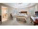 Comfortable bedroom featuring neutral tones, a ceiling fan, and an ensuite bathroom at 1111 Waterford Green Pt, Marietta, GA 30068