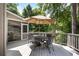 Charming outdoor deck with dining area, ideal for enjoying meals amidst the serene natural surroundings at 1111 Waterford Green Pt, Marietta, GA 30068