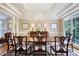 Elegant dining room with coffered ceilings, chandelier, and windows offering natural light and views at 1111 Waterford Green Pt, Marietta, GA 30068