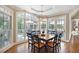 Elegant dining room with hardwood floors, large windows, and access to the outdoor deck at 1111 Waterford Green Pt, Marietta, GA 30068
