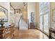 Elegant foyer with hardwood floors, grand staircase, and a striking arched window at 1111 Waterford Green Pt, Marietta, GA 30068