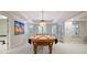 Bright game room with a pool table and large windows, creating an inviting space for entertainment at 1111 Waterford Green Pt, Marietta, GA 30068