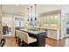 Open kitchen featuring stainless appliances, granite counters, and an island with seating at 1111 Waterford Green Pt, Marietta, GA 30068