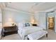 Bright and airy main bedroom showcasing a neutral color palette, decorative crown molding, and a sitting bench at 1111 Waterford Green Pt, Marietta, GA 30068