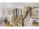 Open staircase with dark wood railings and neutral walls leading to the upper level at 1111 Waterford Green Pt, Marietta, GA 30068