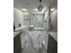 Modern bathroom featuring a soaking tub, walk-in shower, and sleek marble tile at 125 Sir Lancelot Ct, Fayetteville, GA 30214