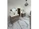 Stylish bathroom featuring double vanity with modern fixtures and marble-patterned flooring at 125 Sir Lancelot Ct, Fayetteville, GA 30214