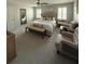 Spacious bedroom with a king bed, sitting area and modern decor at 125 Sir Lancelot Ct, Fayetteville, GA 30214