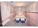 Charming pink bedroom featuring natural light, and decorative wall accessories at 125 Sir Lancelot Ct, Fayetteville, GA 30214