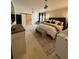 Serene bedroom with neutral tones, a king-size bed and custom lighting at 125 Sir Lancelot Ct, Fayetteville, GA 30214