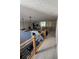 View of the loft area featuring modern railing and overlooking the open living room below at 125 Sir Lancelot Ct, Fayetteville, GA 30214