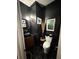 Modern powder room featuring black walls, a vessel sink, and hexagon tile flooring at 125 Sir Lancelot Ct, Fayetteville, GA 30214