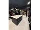 A luxurious walk-in closet with a central island and custom storage solutions at 125 Sir Lancelot Ct, Fayetteville, GA 30214