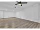 Large basement with neutral colors and a ceiling fan at 3860 Paint Cir, Douglasville, GA 30135