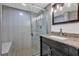Modern bathroom with tiled shower, glass door, and granite vanity at 3860 Paint Cir, Douglasville, GA 30135