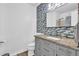 Bathroom featuring granite countertop and tiled accent wall at 3860 Paint Cir, Douglasville, GA 30135