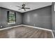 Bedroom with neutral colors, ceiling fan, and a view of a window at 3860 Paint Cir, Douglasville, GA 30135
