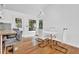 Open-concept kitchen and dining area with modern lighting and windows at 3860 Paint Cir, Douglasville, GA 30135
