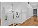 Bright foyer with hardwood floors, white staircase, a decorative chandelier and front door with sidelights at 3860 Paint Cir, Douglasville, GA 30135
