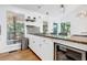 Kitchen with granite counters, stainless fridge and a view of the yard through a window at 3860 Paint Cir, Douglasville, GA 30135