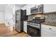 Updated kitchen with stainless steel appliances and granite countertops at 3860 Paint Cir, Douglasville, GA 30135