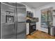 Modern kitchen featuring stainless steel appliances, granite countertops, and mosaic backsplash at 3860 Paint Cir, Douglasville, GA 30135