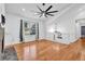 Hardwood floors, stone fireplace, and large window create a welcoming and bright atmosphere at 3860 Paint Cir, Douglasville, GA 30135