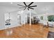 Open-concept living space with hardwood floors, leading into the kitchen and dining area at 3860 Paint Cir, Douglasville, GA 30135