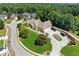 Lovely home on a cul-de-sac with an expansive circular driveway and manicured lawn in a wooded neighborhood at 2012 Arbor Springs Way, Buford, GA 30519