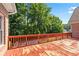 Spacious outdoor wooden deck area surrounded by mature trees, perfect for relaxing or entertaining at 2012 Arbor Springs Way, Buford, GA 30519