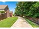 A long driveway leading to the house from the backyard of the property at 2012 Arbor Springs Way, Buford, GA 30519