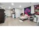 Spacious finished basement with seating area, kitchenette, wood flooring and wall decor at 2012 Arbor Springs Way, Buford, GA 30519