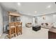Spacious finished basement with a bar area, comfortable seating, and carpeted floors at 2012 Arbor Springs Way, Buford, GA 30519