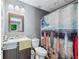 Bathroom featuring a vanity, toilet, and shower with a decorative curtain at 2012 Arbor Springs Way, Buford, GA 30519