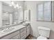 Clean bathroom featuring a vanity with sink, toilet, and tiled shower/bath combination at 2012 Arbor Springs Way, Buford, GA 30519