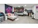 Bedroom with bed and colorful wall hangings at 2012 Arbor Springs Way, Buford, GA 30519