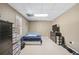View of bedroom with a large window, black dressers and carpeted floor at 2012 Arbor Springs Way, Buford, GA 30519