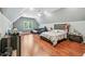 Large bonus room with hardwood floors, couch, and nice sized bed at 2012 Arbor Springs Way, Buford, GA 30519