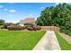 A long driveway leading to the house surrounded by manicured bushes at 2012 Arbor Springs Way, Buford, GA 30519