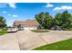Beautiful home with a circular driveway, three-car garage, and well-maintained landscaping at 2012 Arbor Springs Way, Buford, GA 30519