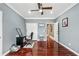 Functional home office with hardwood floors, neutral paint, and ample space for productivity at 2012 Arbor Springs Way, Buford, GA 30519