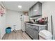 Kitchenette with gray cabinets and white appliances at 2012 Arbor Springs Way, Buford, GA 30519