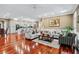 Spacious open-concept living room with hardwood floors and neutral tones provides a cozy atmosphere at 2012 Arbor Springs Way, Buford, GA 30519