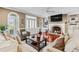 Comfortable living room with a fireplace and built-in shelving showcases warmth at 2012 Arbor Springs Way, Buford, GA 30519