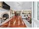 Warm living room with hardwood floors, fireplace, and open view to the kitchen, perfect for entertaining at 2012 Arbor Springs Way, Buford, GA 30519