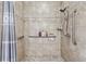 Modern tiled shower with grab bars and handheld shower head at 2012 Arbor Springs Way, Buford, GA 30519