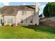 Home exterior with large backyard, lawn, fence, and patio at 303 Fox Overlook, Woodstock, GA 30188