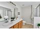 Bathroom featuring double sinks, vanity, and a walk-in shower at 303 Fox Overlook, Woodstock, GA 30188